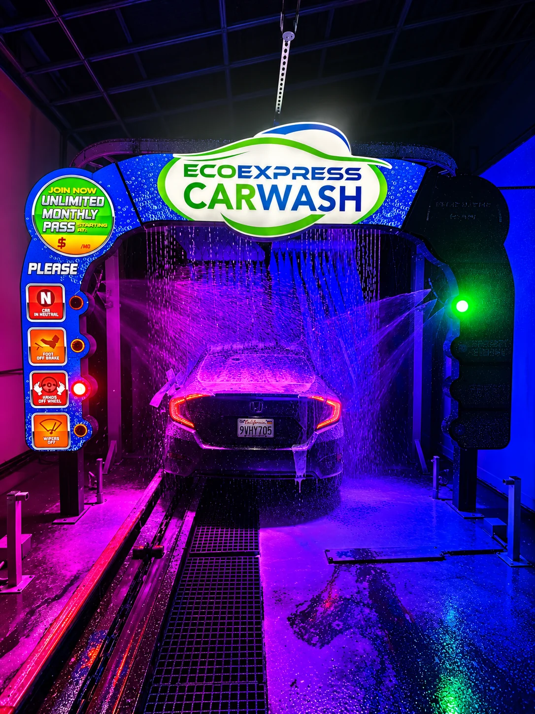 Eco Express Car Wash tunnel with a car receiving a wash